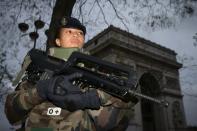 A French soldier patrols in front of the Arc de Triomphe in Paris after the November 2015 terror attacks