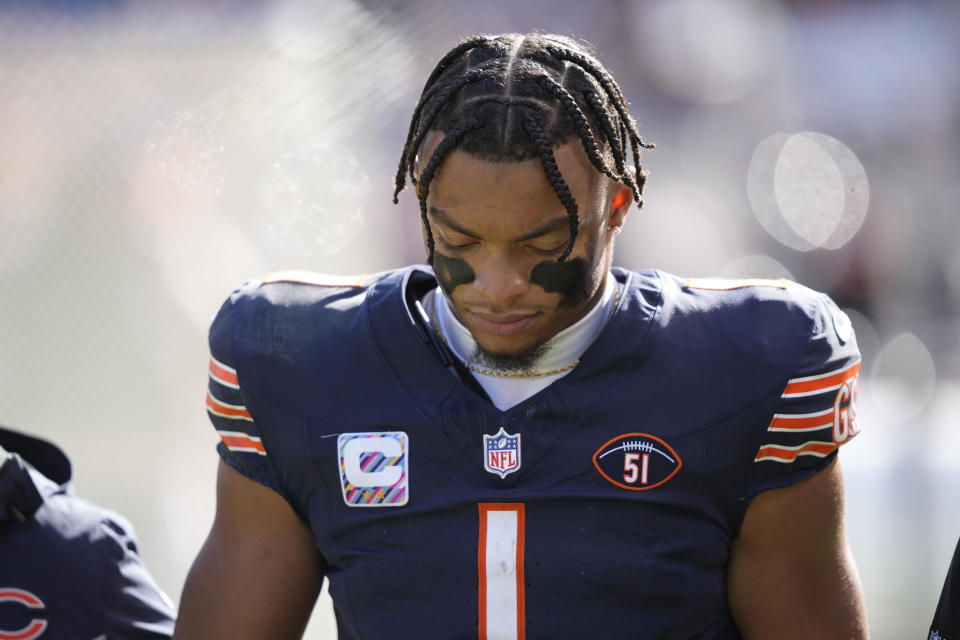 Chicago Bears quarterback Justin Fields walks to the locker room after being sacked during the second half of an NFL football game against the Minnesota Vikings, Sunday, Oct. 15, 2023, in Chicago. (AP Photo/Charles Rex Arbogast)
