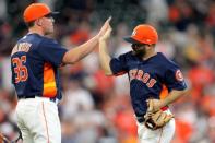 Sep 23, 2018; Houston, TX, USA; Houston Astros relief pitcher Will Harris (36) and second baseman Jose Altuve (27) celebrate after the final out of a 6-2 win over the Los Angeles Angels at Minute Maid Park. Mandatory Credit: Erik Williams-USA TODAY Sports