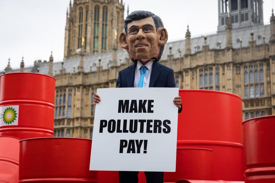 London, UK. 19th Sep, 2023. An Oxfam protestor dressed as Rishi Sunak is seen outside Parliament. Oxfam's ''Make Polluters Pay'' campaign is calling on large oil and gas companies such as BP and Shell, to pay more taxes to help raise funds to aid communities devastated by climate change. (Credit Image: © Tejas Sandhu/SOPA Images via ZUMA Press Wire) EDITORIAL USAGE ONLY! Not for Commercial USAGE!