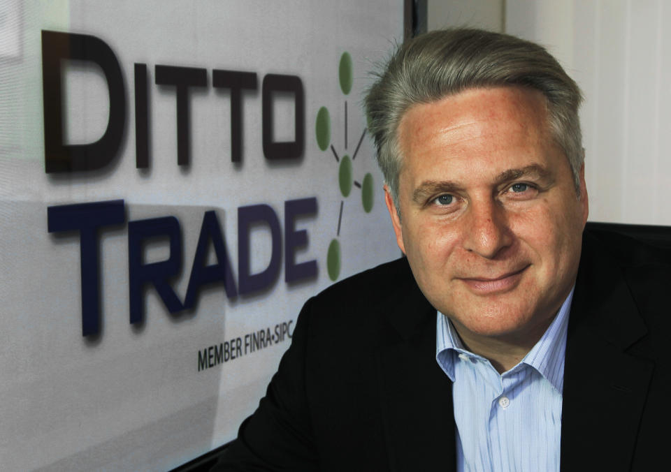 In this Sept. 12, 2012, photo, Joe Fox, CEO of Ditto Trade, poses in his offices in Los Angeles. Ditto Trade is a new online brokerage firm where one can attach their stock portfolio to that of person they trust, so that when they make a trade, so will you. (AP Photo/Reed Saxon)