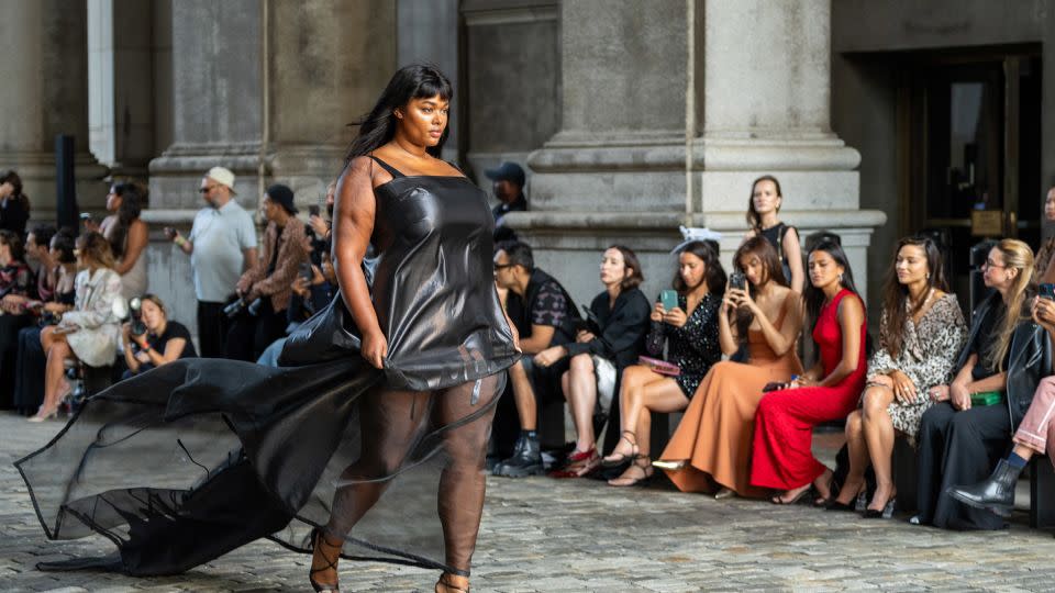 Model Precious Lee in an organza slip dress with a black drip motif. Gurung’s celebratory collection also had ties to the Hindu festival of Holi. - David Dee Delgado/AFP/Getty Images