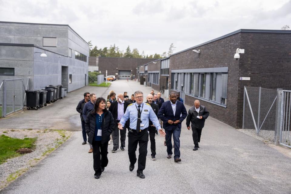 Helge Valseth leads a group of U.S. visitors through Halden prison.