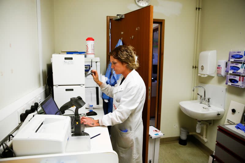 A medical worker tests swabs for the novel coronavirus at the Microbiology department of North Devon District Hospital in Barnstaple