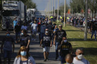 Nissan workers gather during a protest in Barcelona, Spain, Thursday, May 28, 2020. Japanese carmaker Nissan Motor Co. has decided to close its manufacturing plans in the northeastern Catalonia region, resulting in the loss of some 3,000 direct jobs. (AP Photo/Emilio Morenatti)