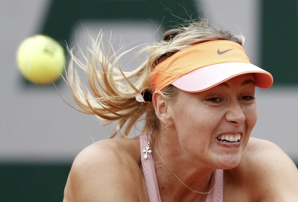 Maria Sharapova of Russia competes against Samantha Stosur of Australia in their women's singles match at the French Open tennis tournament at the Roland Garros stadium in Paris