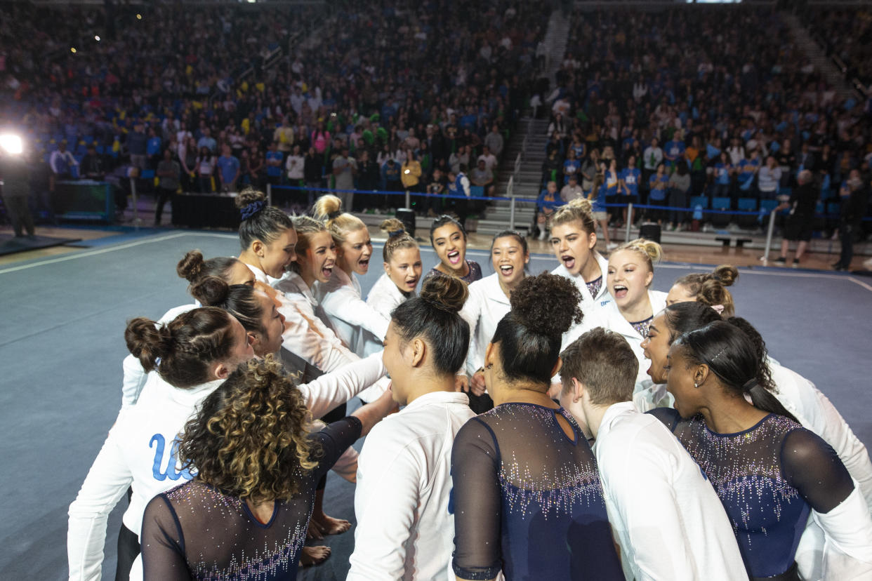 LOS ANGELES, CA - FEBRUARY 16: The UCLA women's gymnastics team cheers before competing against Arizona State University at Pauley Pavilion on Saturday, February 16, 2019. (Allison Zaucha for The Washington Post via Getty Images)
