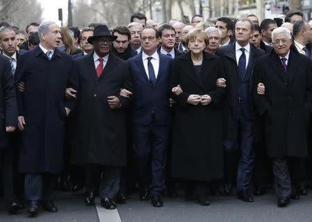 French President Francois Hollande is surrounded by head of states including (L to R) Israel's Prime Minister Benjamin Netanyahu, Mali's President Ibrahim Boubacar Keita, Germany's Chancellor Angela Merkel, European Council President Donald Tusk and Palestinian President Mahmoud Abbas as they attend the solidarity march (Marche Republicaine) in the streets of Paris January 11, 2015. REUTERS/Philippe Wojazer