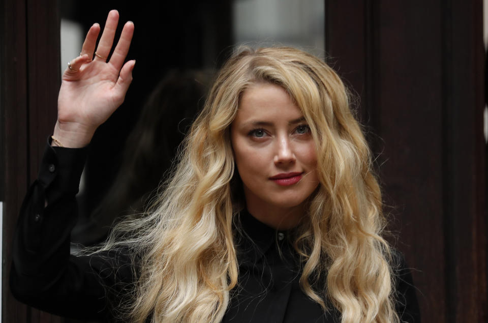 US Actress Amber Heard, former wife of actor Johnny Depp, arrives at the High Court in London, Tuesday, July 28, 2020. Hollywood actor Johnny Depp is suing News Group Newspapers over a story about his former wife Amber Heard, published in The Sun in 2018 which branded him a 'wife beater', a claim he denies.(AP Photo/Frank Augstein)