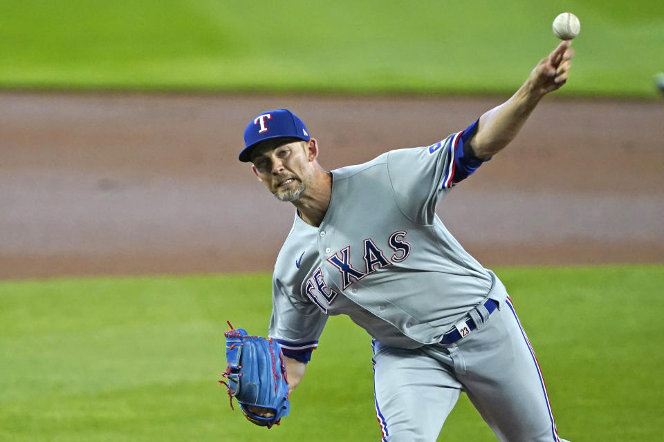 Texas Rangers starting pitcher Mike Minor throws against the Seattle Mariners during the first inning of a baseball game, Sunday, Aug. 23, 2020, in Seattle. (AP Photo/Ted S. Warren)