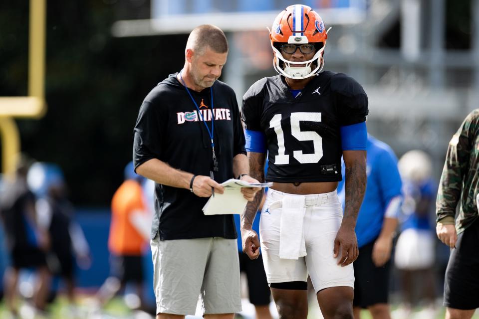 Florida Gators head coach Billy Napier talks with Florida Gators quarterback Anthony Richardson (15) during fall football practice at Sanders Outdoor Practice Fields in Gainesville, FL on Tuesday, August 23, 2022. [Matt Pendleton/Gainesville Sun]