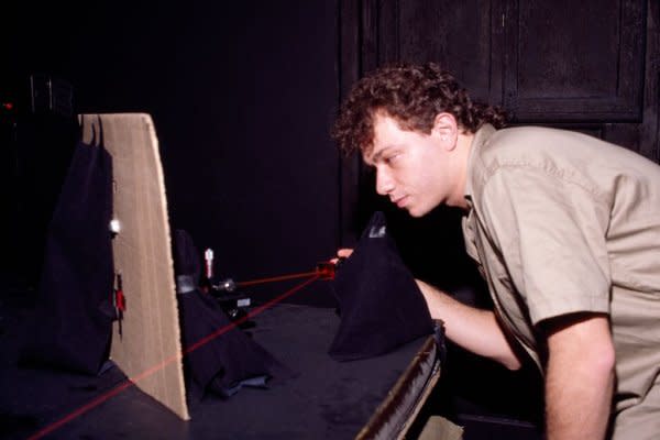 Eduardo Kac is pictured working in his holography studio in Rio de Janiero in 1986. Photo courtesy of Eduardo Kac