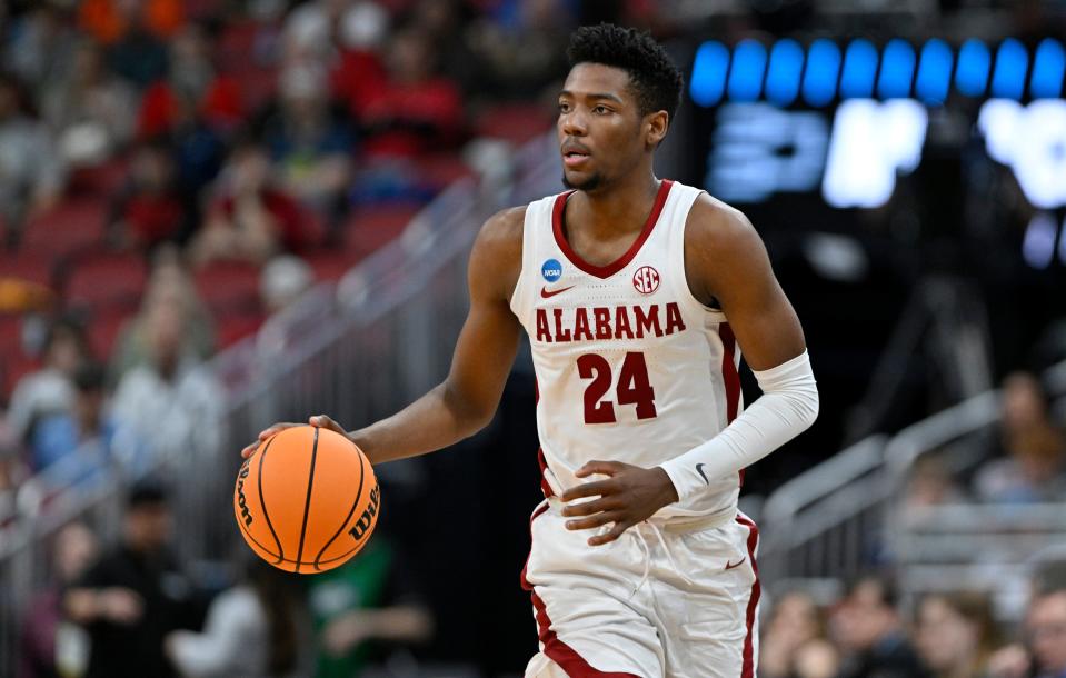 Alabama forward Brandon Miller dribbles during the NCAA Tournament round of 16 game against San Diego State at KFC YUM! Center.