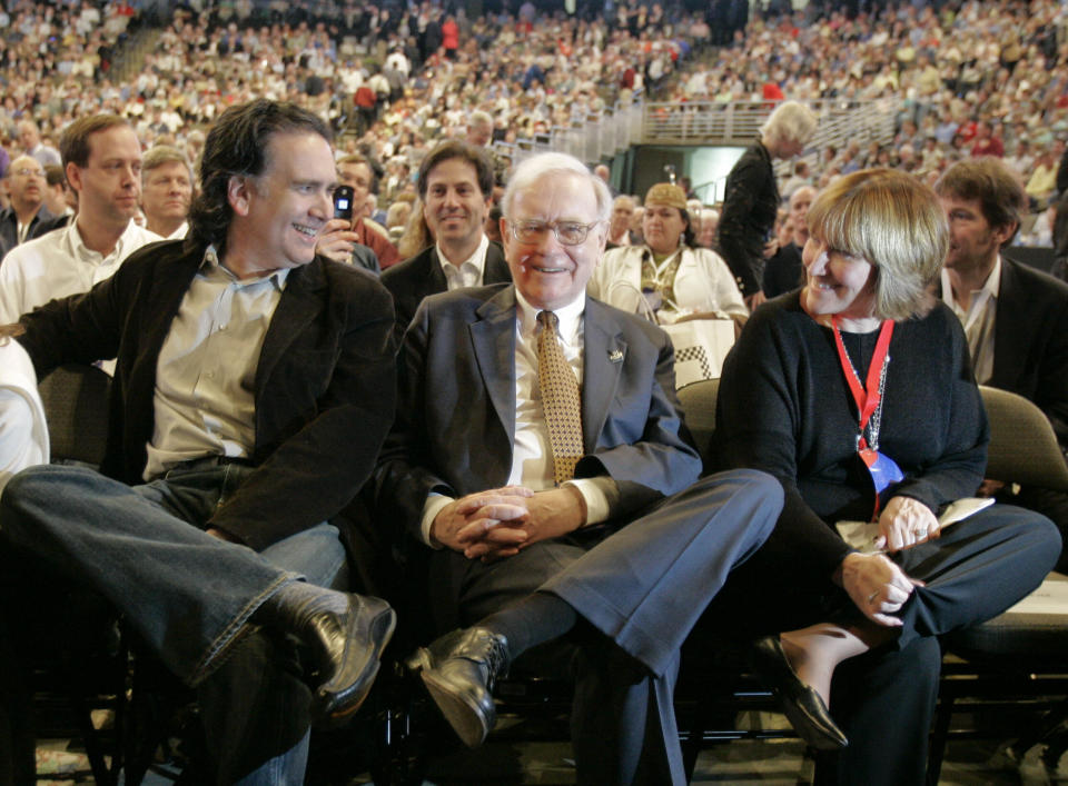 Billionaire investor Warren Buffett is flanked by his son, Peter, and daughter, Susie, as they wait for the company movie to begin during the annual Berkshire Hathaway shareholders meeting in Omaha, Neb., Saturday, May 5, 2007. (AP Photo/Nati Harnik)