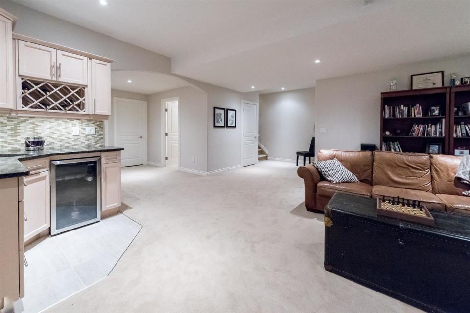 <p><span>19 Kingsford Cres., St. Albert, Alta.</span><br>The basement is fully furnished, and, in addition to two bedrooms, there’s another three-piece bathroom, a gas fireplace and a wet bar.<br>(Photo: Zoocasa) </p>