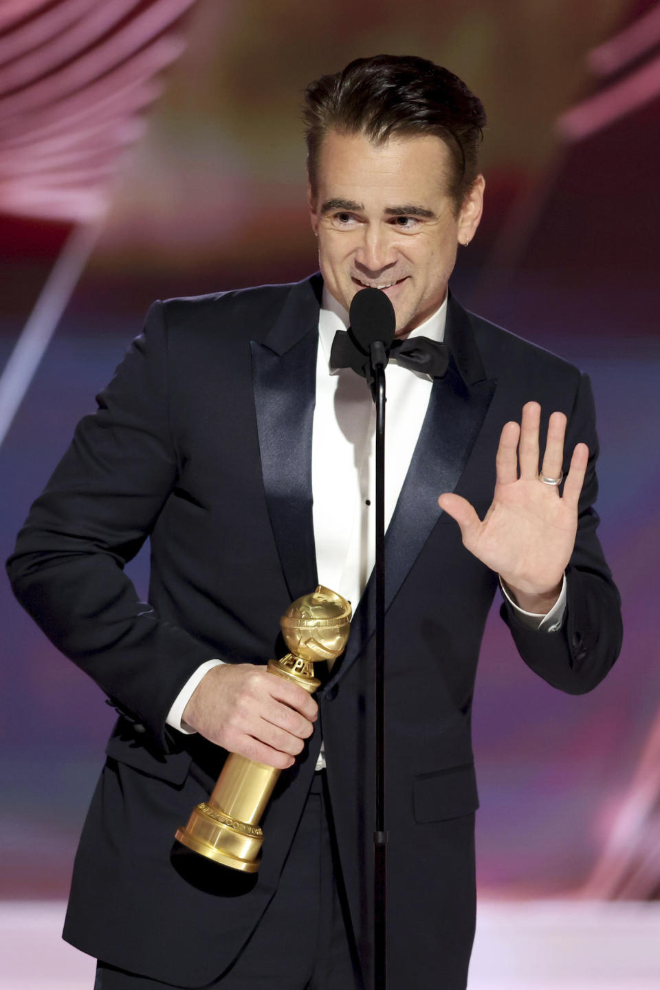 This image released by NBC shows Colin Farrell accepting the Best Actor in a Motion Picture – Musical or Comedy award for "The Banshees of Inisherin" during the 80th Annual Golden Globe Awards at the Beverly Hilton Hotel on Tuesday, Jan. 10, 2023, in Beverly Hills, Calif. (Rich Polk/NBC via AP)