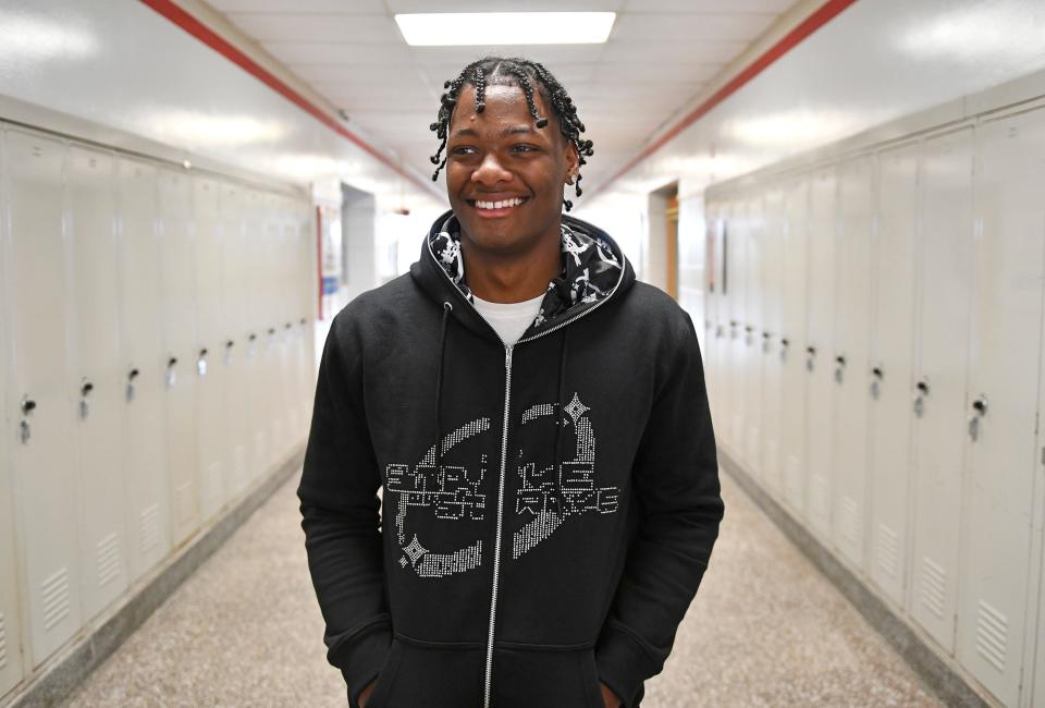 Vineland High School senior Antwain Rivera shows off his latest Strive or Starve hoodie design on Thursday, May 12, 2022.