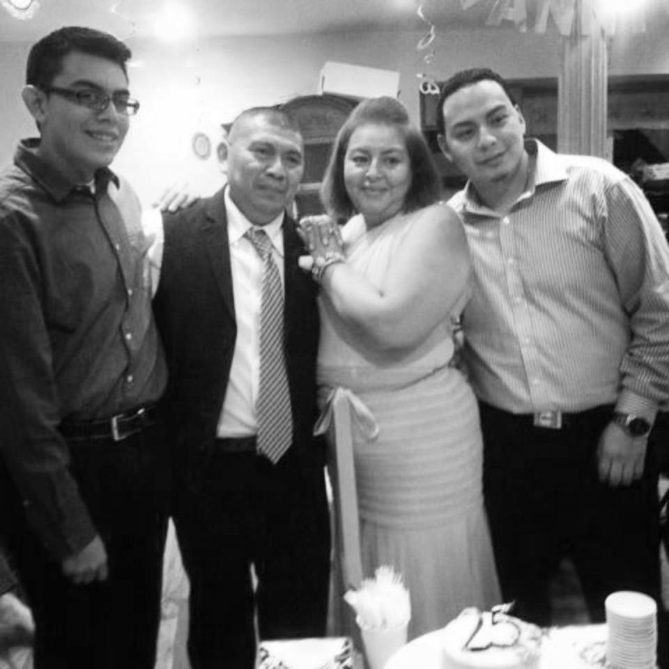 Image: Julio Ramirez, left with his parents and brother. (Family photo)