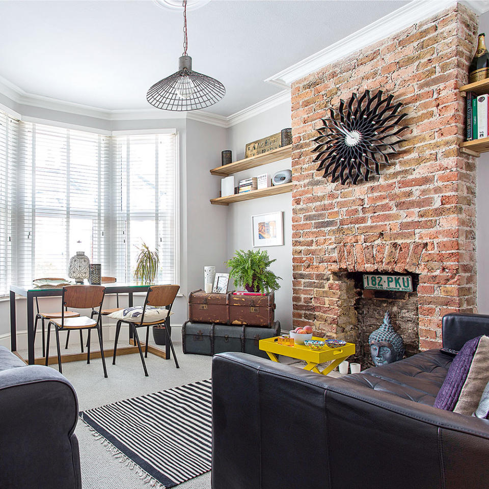 <p> Create a feature wall of sorts by exposing the original brickwork of a chimney breast. This simple task will instantly welcome a touch of rustic charm to any scheme. This grey living room proves how the rustic nature of brick doesn't have to overwhelm a more modern decor, it merely balances the look. </p> <p> If removing plasterboard that has been covering up the fireplace you will probably need to clean the bricks up, to make them look back to best. A gentle clean with a hard bristle brush will remove any crumbling mortar and excess dust. Choose to add another rustic touch with reclaimed wooden shelving either side, for a smart alcove idea. </p>