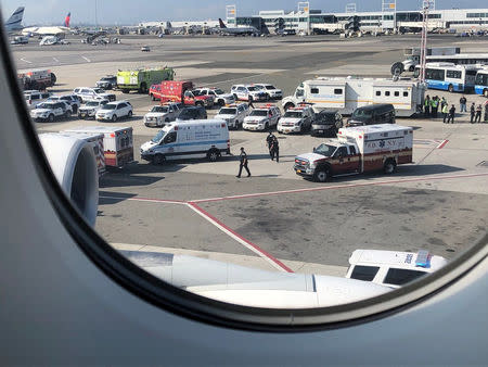 The emergency services are seen, after the passengers were taken ill on a flight from New York to Dubai, on JFK Airport, New York, U.S., September 05, 2018 in this still image obtained from social media. Larry Coben/via REUTERS