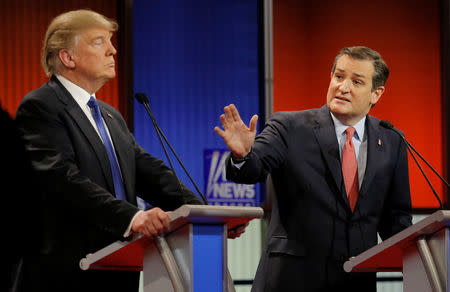 FILE PHOTO: Republican U.S. presidential candidate Ted Cruz gestures over at rival candidate Donald Trump (L) at the U.S. Republican presidential candidates debate in Detroit, Michigan, U.S., March 3, 2016. REUTERS/Jim Young/File Photo