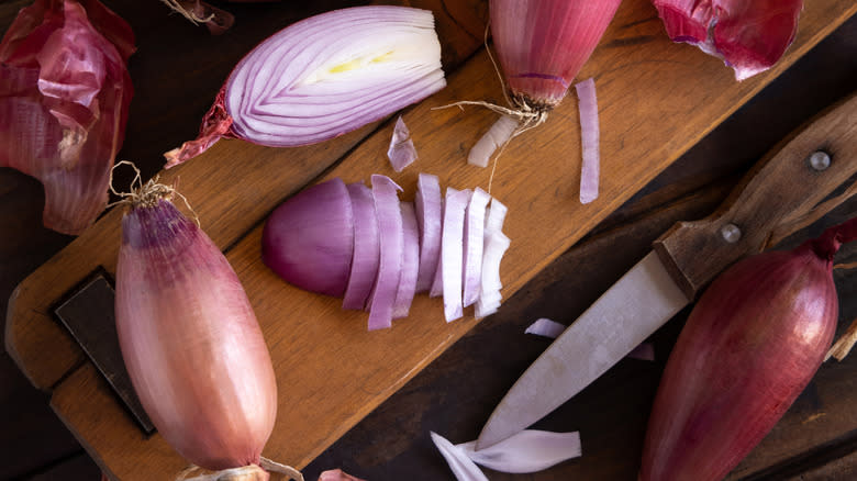 Sliced shallots on a cutting board