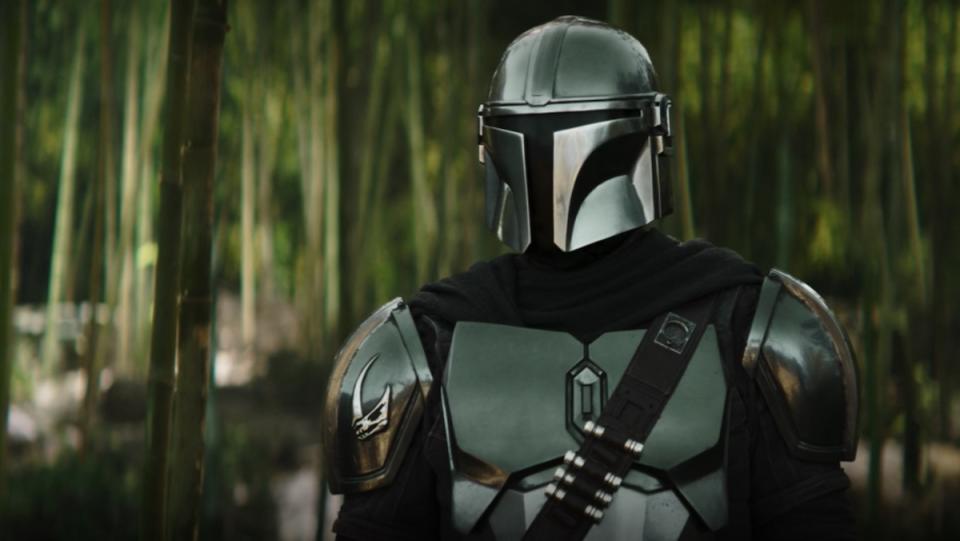 Din Djarin in a jungle forest on The Book of Boba Fett. Pedro Pascal mostly provides the voice of The Mandalorian's Din Djarin these days.