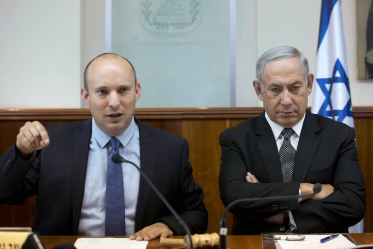 Israeli Education Minister Naftali Bennett (L), seen with Prime Minister Benjamin Netanyahu in August 2016, succeeded in rallying support for the vote on a bill to legalise the Amona Jewish settlements in the West Bank