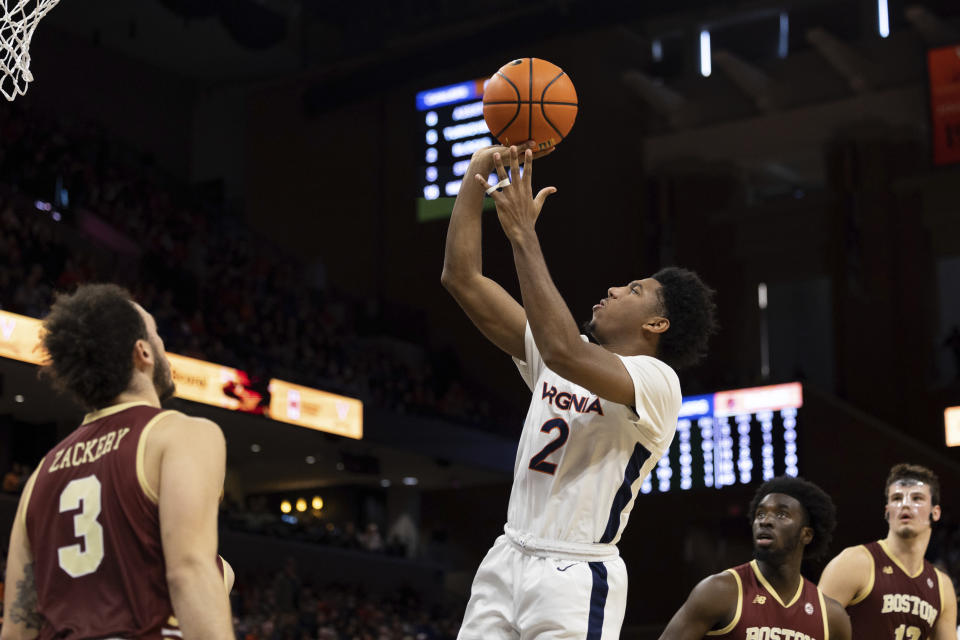 Virginia's Reece Beekman (2) shoots against Boston College during the second half of an NCAA college basketball game in Charlottesville, Va., Saturday, Jan. 28, 2023. (AP Photo/Mike Kropf)