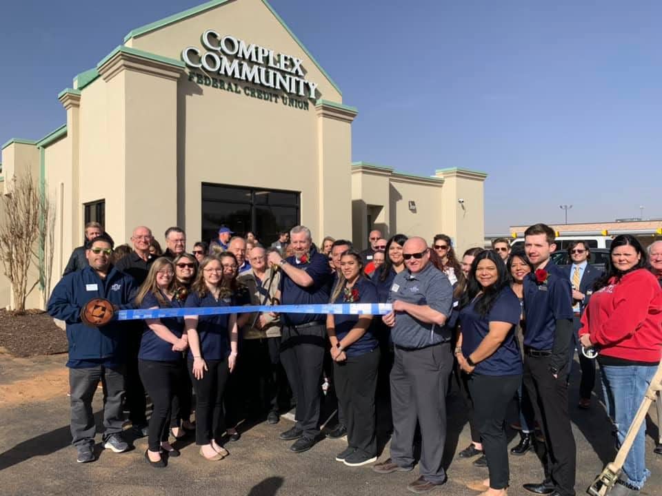 Complex Community Federal Credit Union, 6402 Frankford Ave. Holding scissors is President and CEO Jason Berridge. Holding ribbon are Chamber Ambassadors Shay Gonzalez, left, and Michael Yost. Others pictured are Complex Community FCU staff and board members, family, friends and Lubbock Chamber Ambassadors.