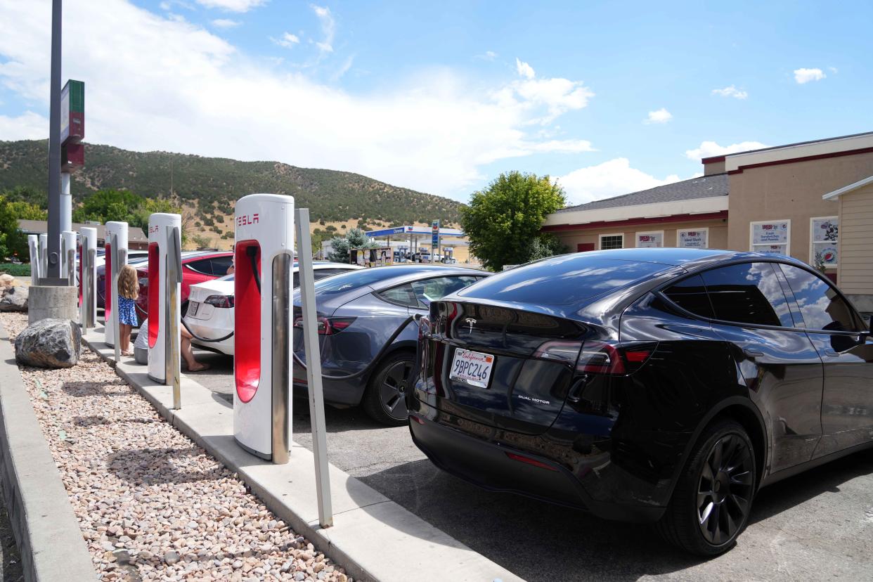 NEPHI, UT - JULY 17: A line of Tesla cars charge on July 17, 2022 in Nephi, Utah. With more electric cars on the road, lack of charging infrastructure is becoming more of a problem for EV owners.  (Photo by George Frey/Getty Images)