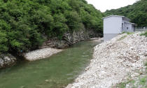 A construction of a small hydro power plant is seen along the Zeljeznica river near the town of Trnovo, Saturday, July 9, 2022. It took a decade of court battles and street protests, but Balkan activists fighting to protect some of Europe's last wild rivers have scored an important conservation victory in Bosnia. A new electricity law, which passed Thursday, bans the further construction of small hydroelectric power plants in the larger of Bosnia's two independent entities. (AP Photo/Eldar Emric)