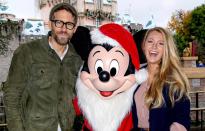 <p>The couple stopped for a picture with Mickey donning his best Santa gear in December 2016.</p>