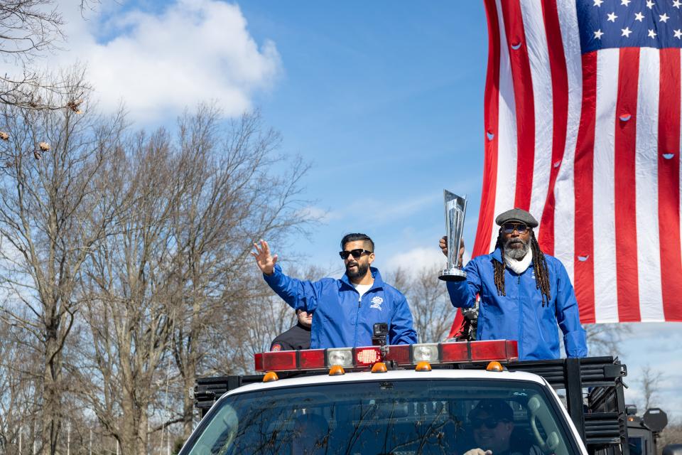 Legendary West Indies cricketer Chris Gayle and Ali Khan of the U.S. cricket team accompany the trophy as enters the site of the Nassau County Cricket Stadium in Eisenhower Park, Nassau County, New York on March 19, 2024.