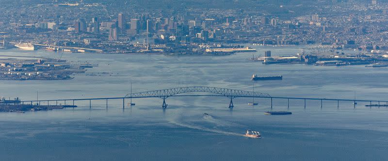 A ship moves under the Francis Scott Key Bridge near Baltimore, on the day U.S. President Joe Biden travels to Washington