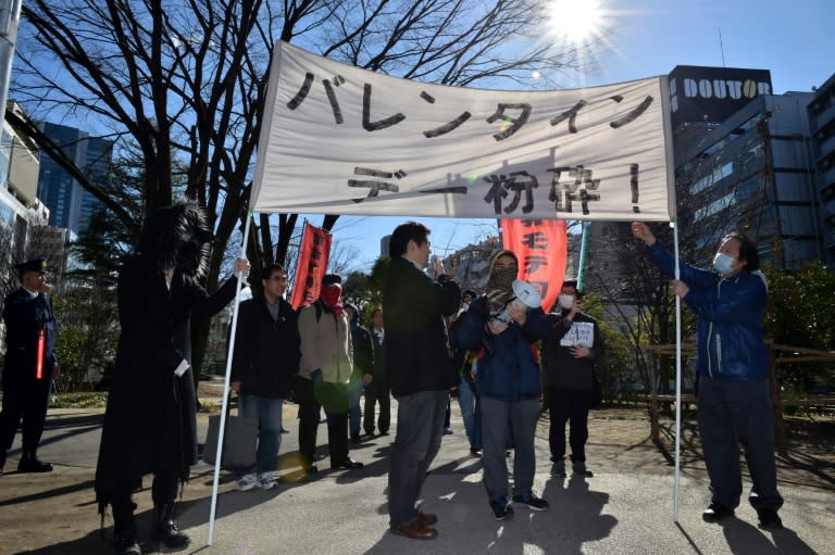 A group of Japanese gather to stage an anti-Valentine's Day demonstration march in Tokyo, on February 12, 2017