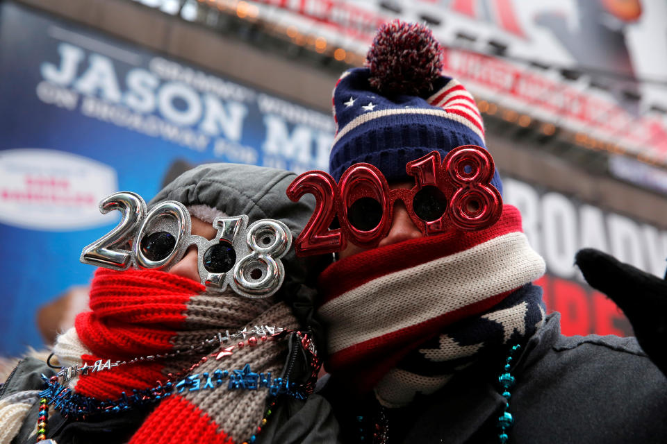 <p>Revelers gather in Times Square as a cold weather front hits the region ahead of New Year’s celebrations in Manhattan, New York, December 31, 2017. (Photo: Andrew Kelly/Reuters) </p>