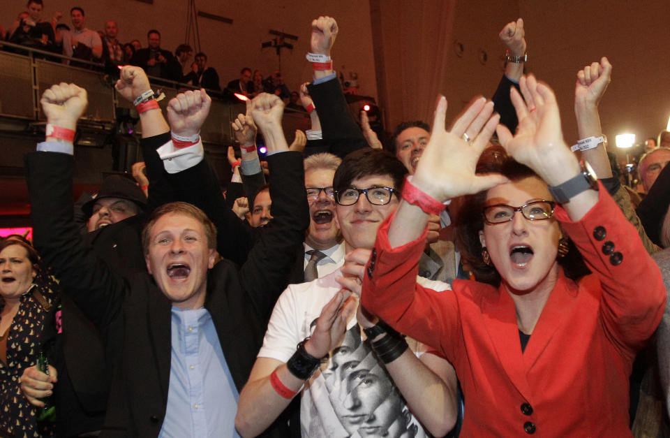 Social Democratic Party members react after the first results were published in Duesseldorf, Germany, Sunday May 13, 2012. Germany's most populated and industrial state holds parliament elections on Sunday. (AP Photo/Frank Augstein)