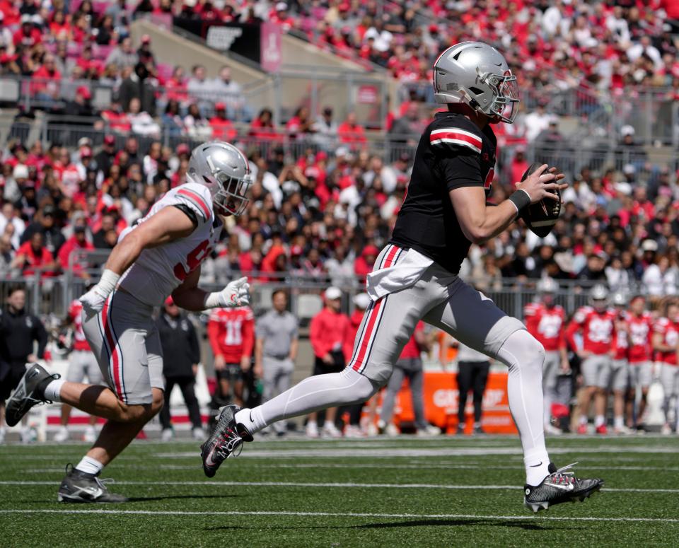 Ohio State quarterback Lincoln Kienholz runs the football on Saturday.