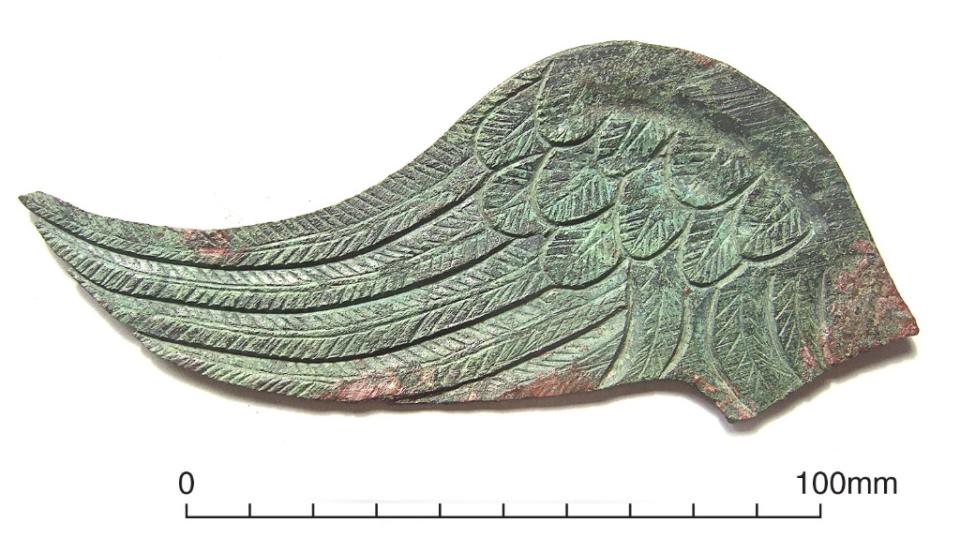 After cleaning, the wing still has a greenish hue left from hundreds of years of corrosion.