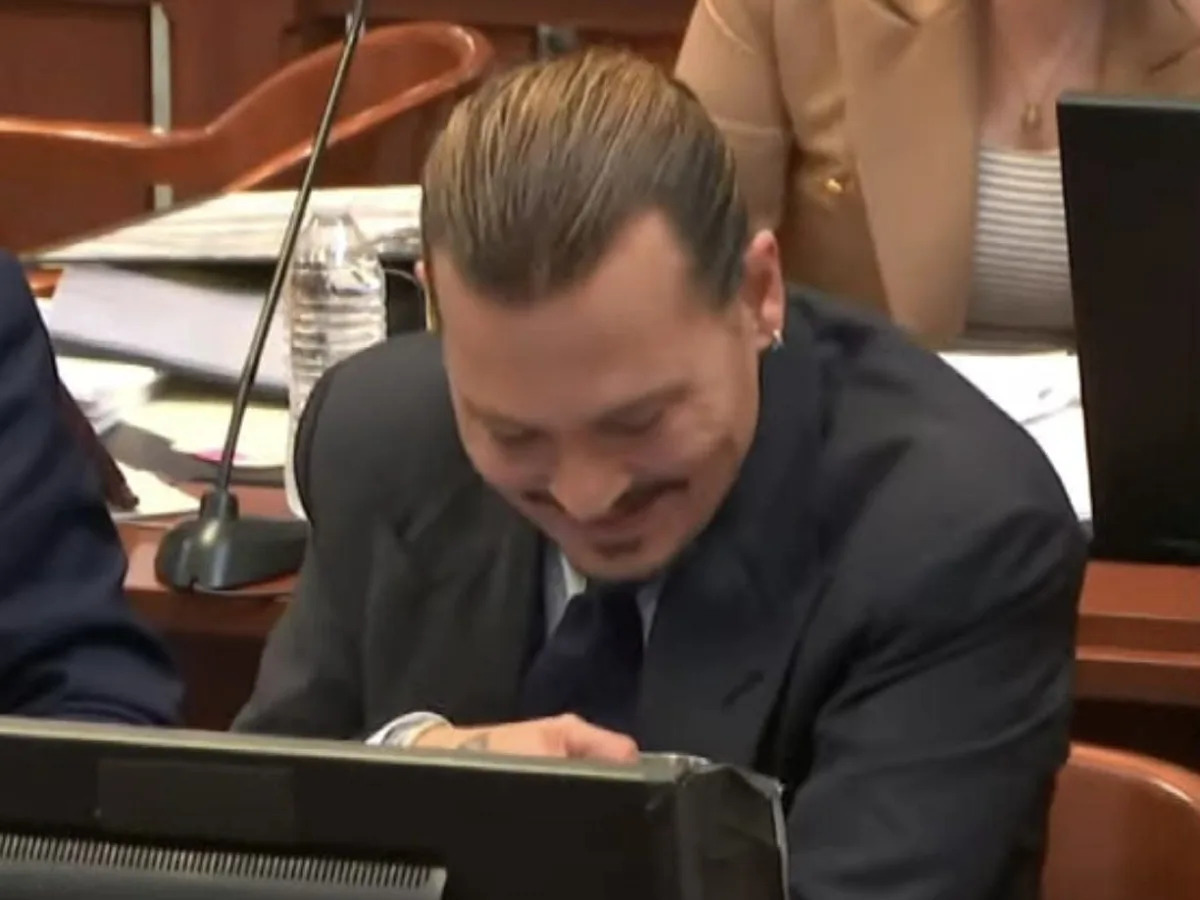 Johnny Depp laughs in court as Amber Heard says he's not an 'accurate historian'..