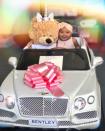 "I'm not sure what’s cuter, the cute teddy bear driving the Bentley truck or True’s cheeks and smile," wrote the new mom.