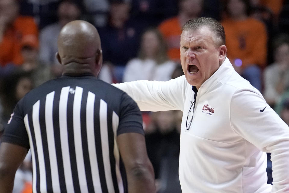 Illinois coach Brad Underwood yells at a referee during the second half of the team's NCAA college basketball game against Marquette, Tuesday, Nov. 14, 2023, in Champaign, Ill. (AP Photo/Charles Rex Arbogast)
