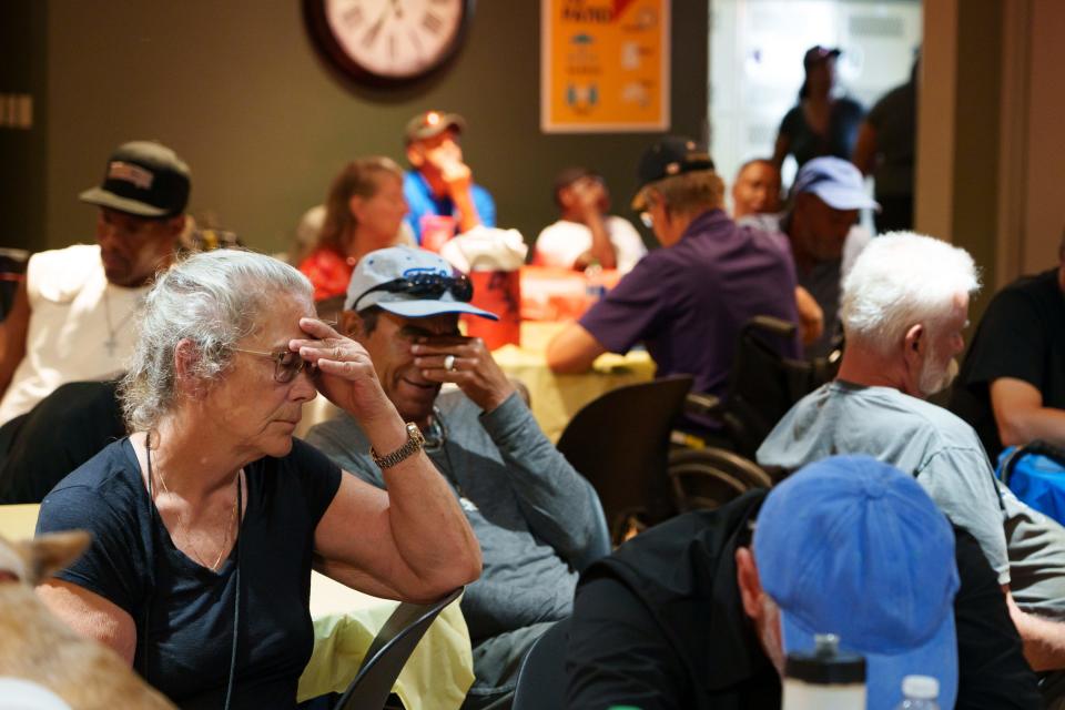 K.C. Griffin (Left) sits in a crowded room at Justa Center, one of the valleyÕs many cooling centers during a heat wave on July 16, 2023 in Phoenix, AZ.