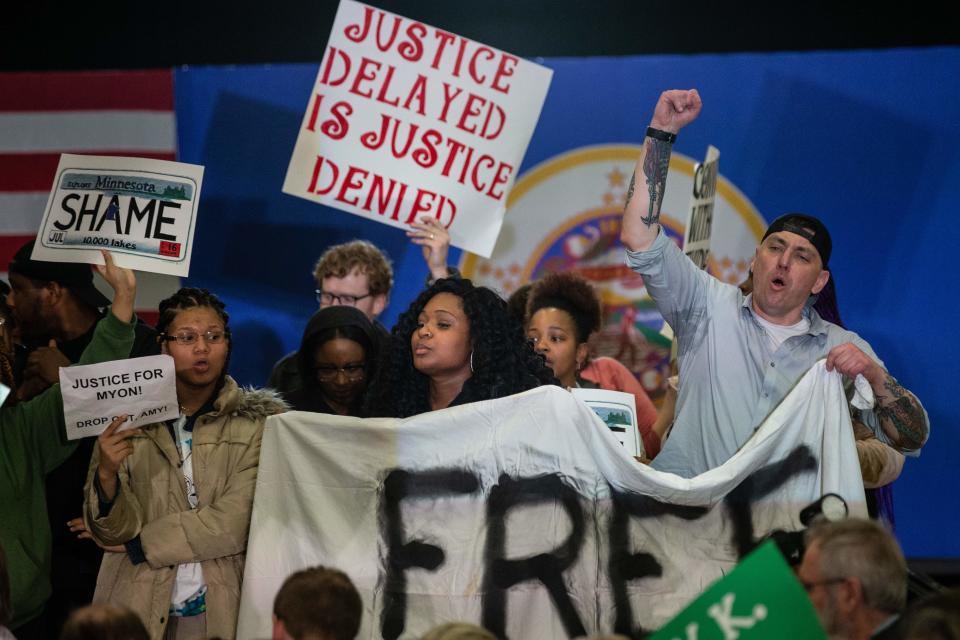 Protestors take over the stage forcing Democratic presidential hopeful Minnesota Senator Amy Klobuchar to cancel her rally before it even started on March 1, 2020 in St. Louis Park, west of Minneapolis, Minnesota. - Hundreds of Klobuchar supporters witnessed a group of Black Lives Matter protesters demanding her to drop out of the race after her misshandling of Myon Burrell's case in 2002 when she was County Attorney. (Photo by Kerem Yucel / AFP) (Photo by KEREM YUCEL/AFP via Getty Images)