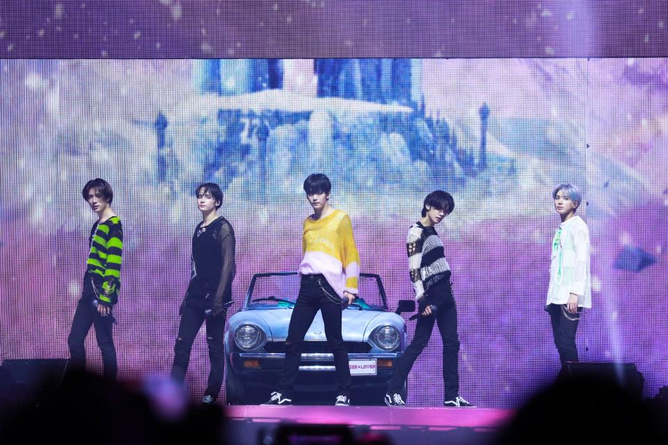 (L-R) Beomgyu, Hueningkai, Soobin, Yeonjun and Taehyun of Tomorrow X Together perform at the Capital One Arena in Washington D.C. on May 16, 2022.