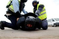 Arab Israeli police recruits detain their colleague during a simulation as part of a training exercise at Israeli police academy center in Beit Shemesh, Israel August 24, 2016. Picture taken August 24, 2016. REUTERS/Ammar Awad