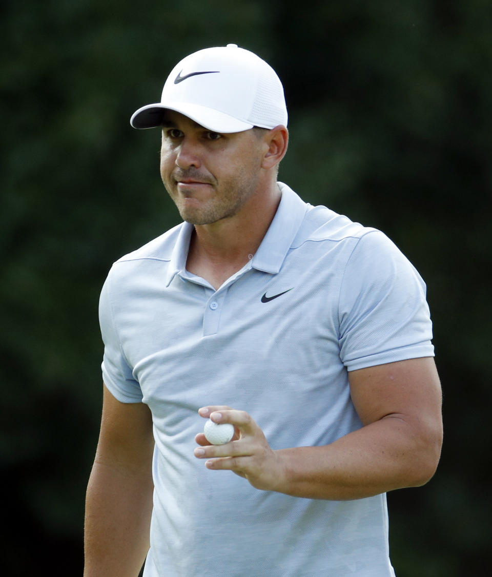 Brooks Koepka reacts after a birdie on the 17th green during the third round of the PGA Championship golf tournament at Bellerive Country Club, Saturday, Aug. 11, 2018, in St. Louis. (AP Photo/Charlie Riedel)