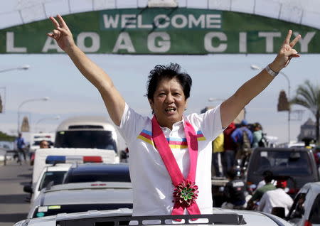 Senator Ferdinand "Bongbong" Marcos, son of late dictator Ferdinand Marcos who is now running for Vice-President gestures during a motorcade campaign at Laoag city, north of Manila, February 9, 2016. REUTERS/Czar Dancel