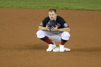 Washington Nationals' Brock Holt crouches at second during a pitching change during the seventh inning of a baseball game against the Philadelphia Phillies, Monday, Sept. 21, 2020, in Washington. (AP Photo/Nick Wass)